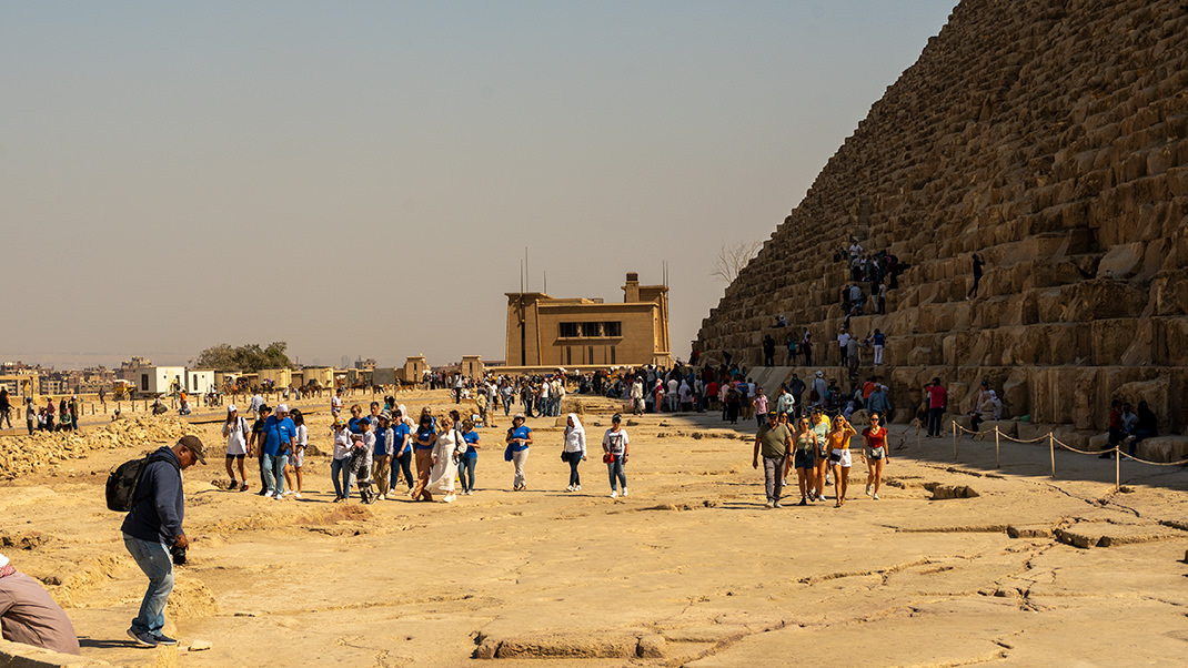 Tourists by the pyramid