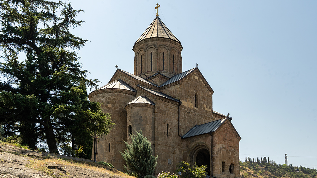 The church is located on a hill near the river