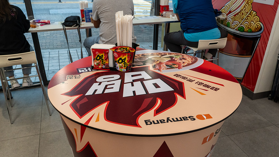 The tables are designed in the shape of noodle cups