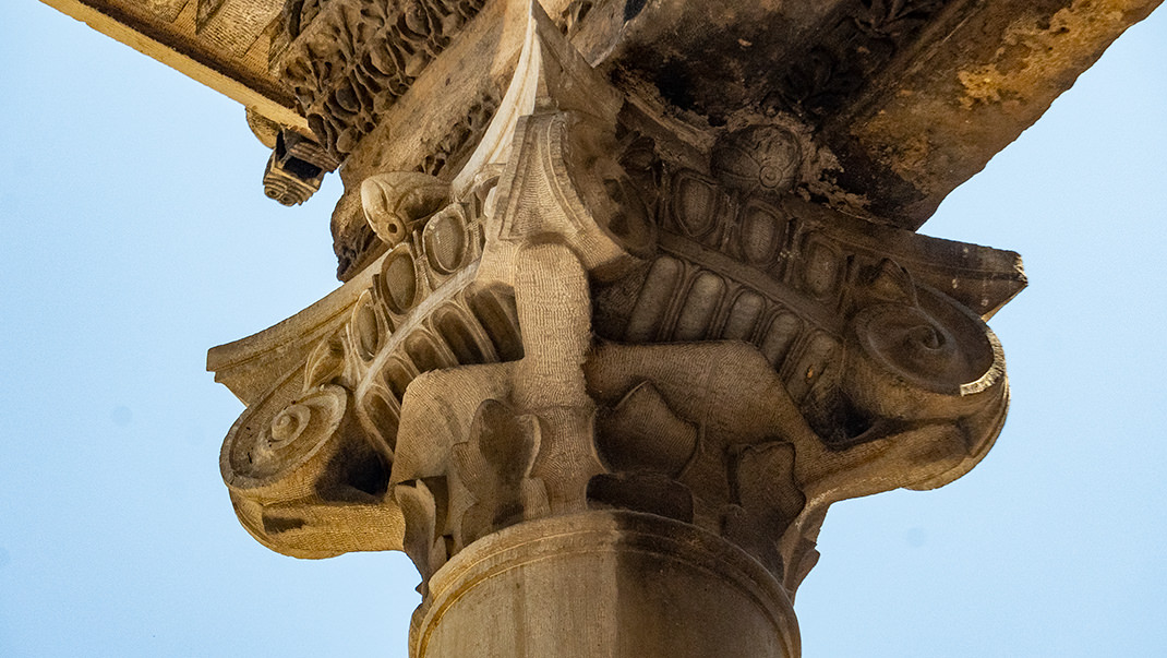 Capital (referring to the top part of a column or pillar)