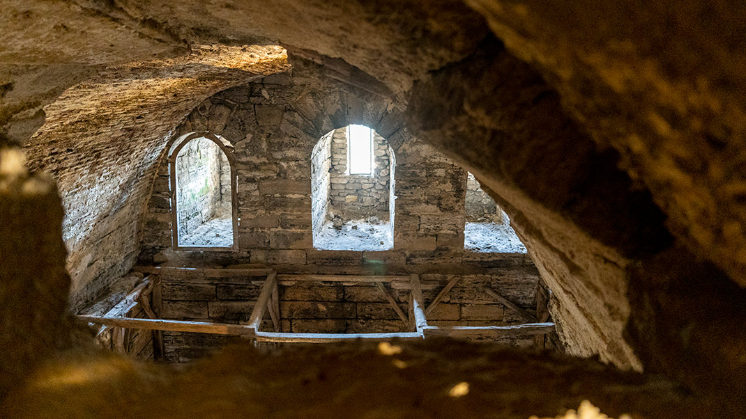 Some walls have hollow spaces, through which the interior of the towers can be seen