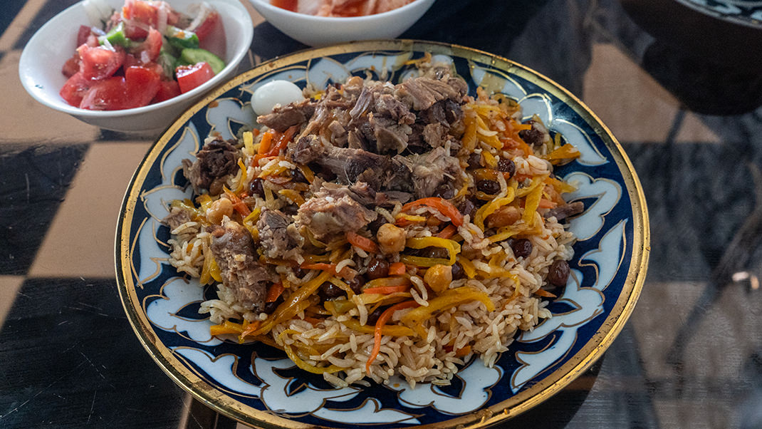 Plov (osh) at one of the cafes. The cost of the dish is 25,000 som