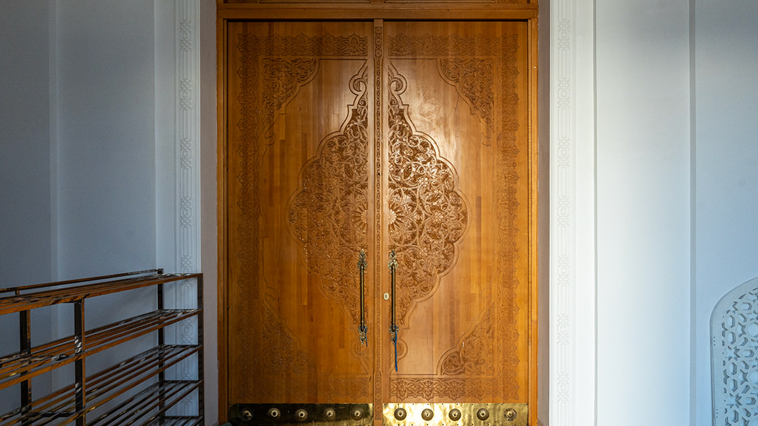 You can peek inside the building through this door